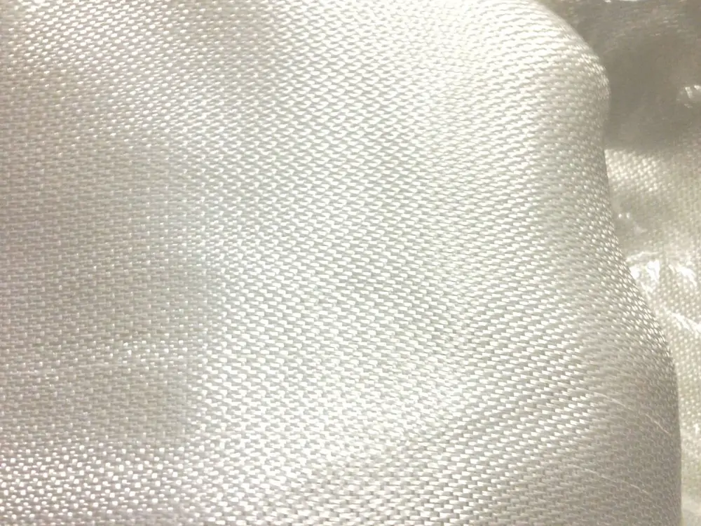FR-4 a woven fiberglass cloth impregnated with an epoxy resin